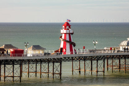 Helter skelter on Cromer Pier during BBC filming with North Sea behind