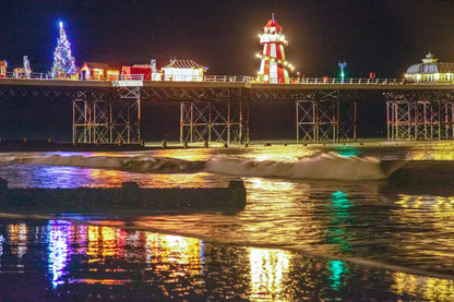 Christmas tree and festive decorations on Cromer Pier Norfolk