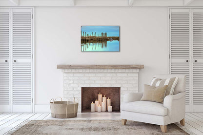 Harbour posts and calm creek reflections at Morston Quay on the Norfolk coast