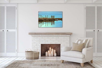 Harbour posts and calm creek reflections at Morston Quay on the Norfolk coast