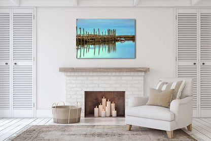 Harbour posts and calm creek reflections at Morston Quay on the Norfolk coast