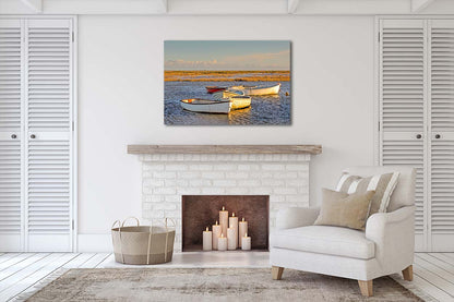 Morston Quay harbour scene with boats on the tidal creek and wide marsh sky